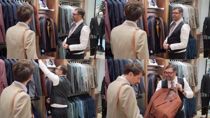 男性顾客，在推销员的帮助下在豪华精品店选择新西装