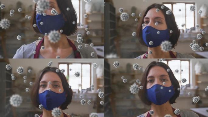 戴口罩的陶器工作室中covid 19细胞对女人的动画