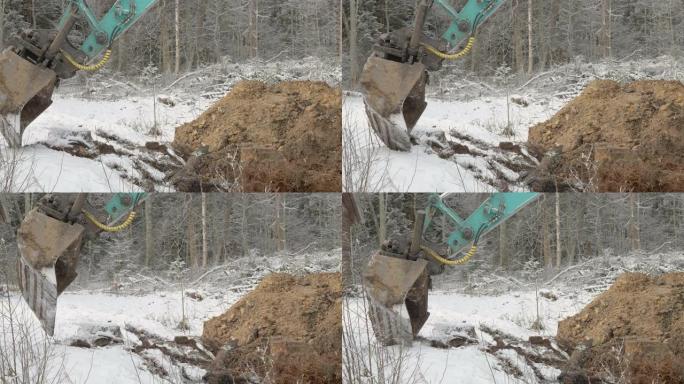 爱沙尼亚从地面上获取土壤的挖掘机铲斗