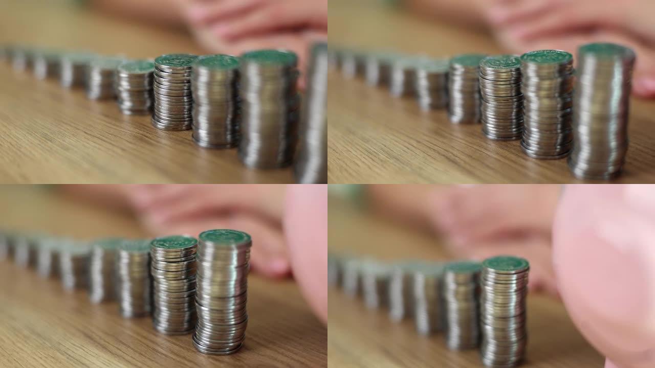 形状像上升的梯子和存钱罐的硬币堆的特写镜头