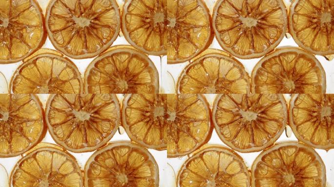 干橙片无缝滴焦糖滴甜酱或蜂蜜。糖果，烹饪手工甜点和糖果