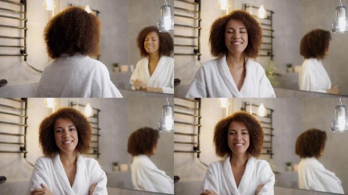 年轻的非洲裔美国妇女在浴室的肖像，早晨的美容程序