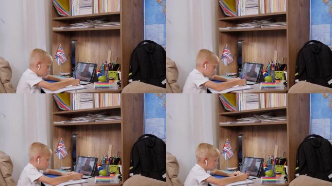 平板电脑男生和老师视频会议聊天。