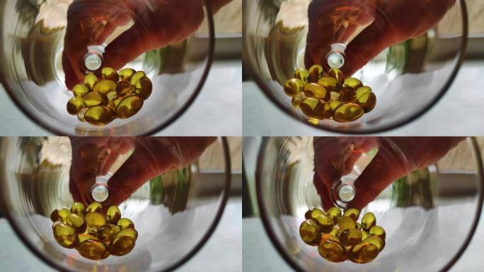 玻璃药物保健概念中的金色药丸欧米茄3关闭分散