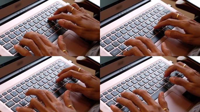 手提电脑键盘上的女人手型