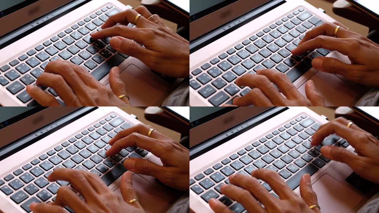 手提电脑键盘上的女人手型