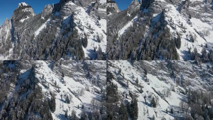 瑞士阿尔卑斯山美丽的冬季仙境的惊人镜头。在卢塞恩州，一架无人驾驶飞机在冰雪覆盖的景观上飞行得非常棒。