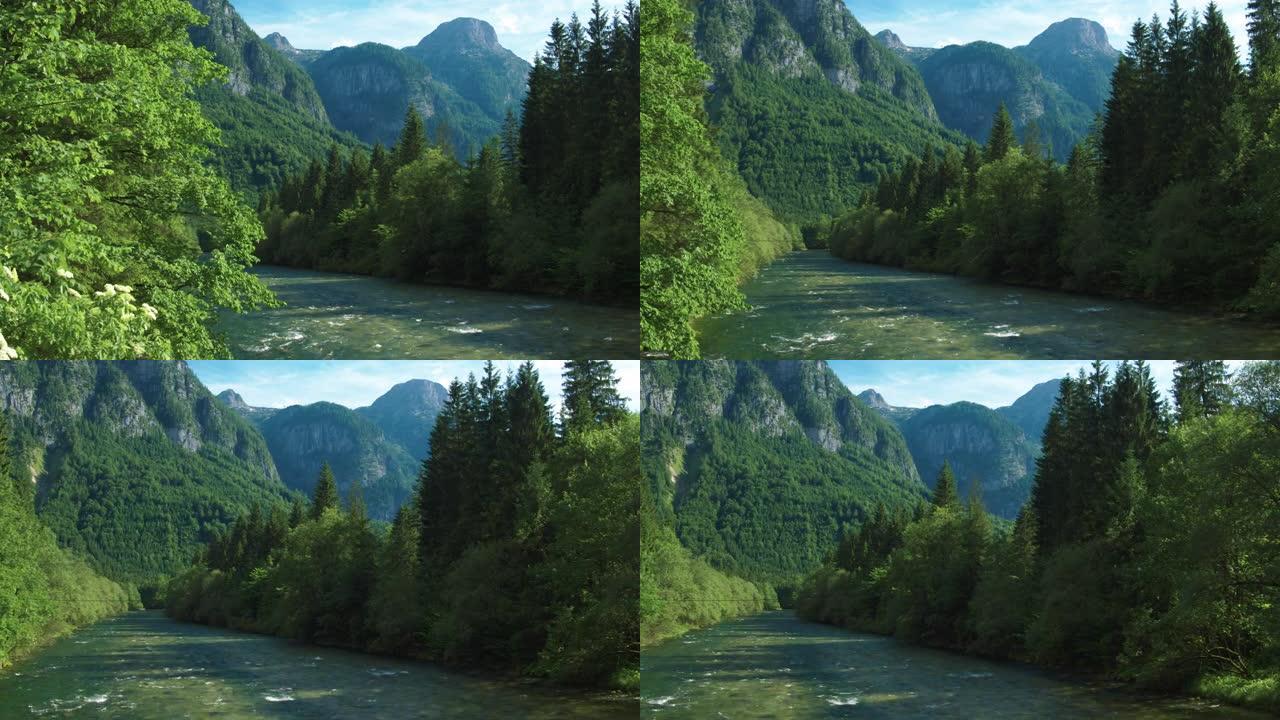 令人惊叹的电影追踪镜头从哈尔施塔特附近的一条河的左至右