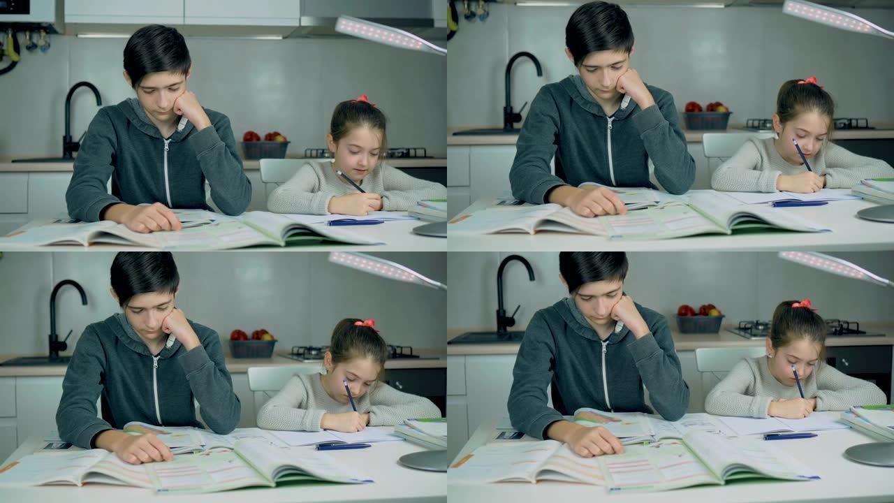 疲惫的学生在家做作业，晚上和小妹妹一起准备考试
