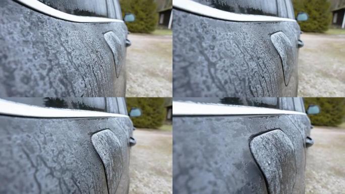 冻结的水颗粒充满了爱沙尼亚的黑色汽车