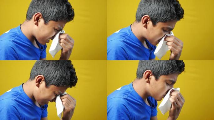 患流感的男孩用餐巾纸鼻涕。