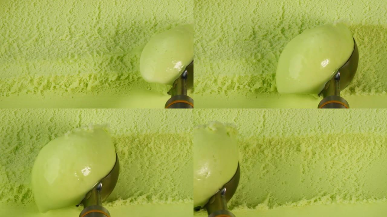 慢动作绿茶冰淇淋用勺子舀。