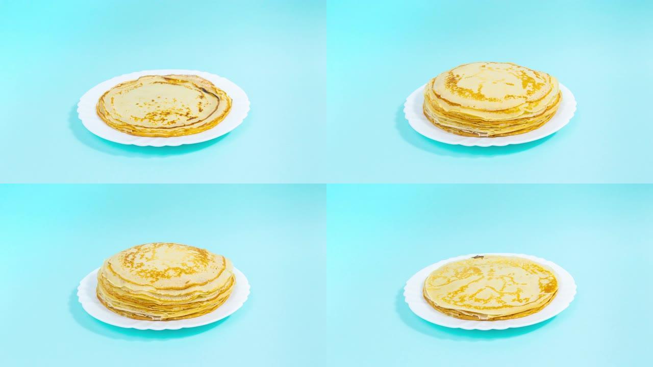 4k煎饼一个接一个地出现在白色盘子上，形成一叠。然后煎饼消失了。
