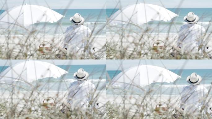 4k视频片段，一个无法识别的男人在海滩上放松