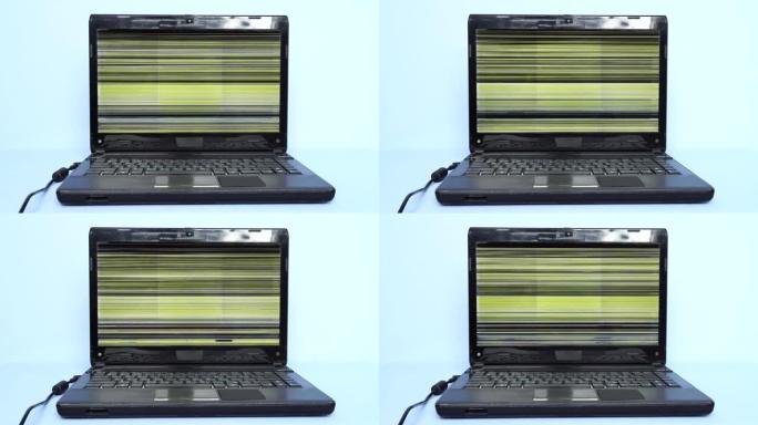 显示器有故障的旧笔记本电脑。在过时的笔记本电脑上工作的问题。突然崩溃和丢失未保存信息的威胁。故障显示