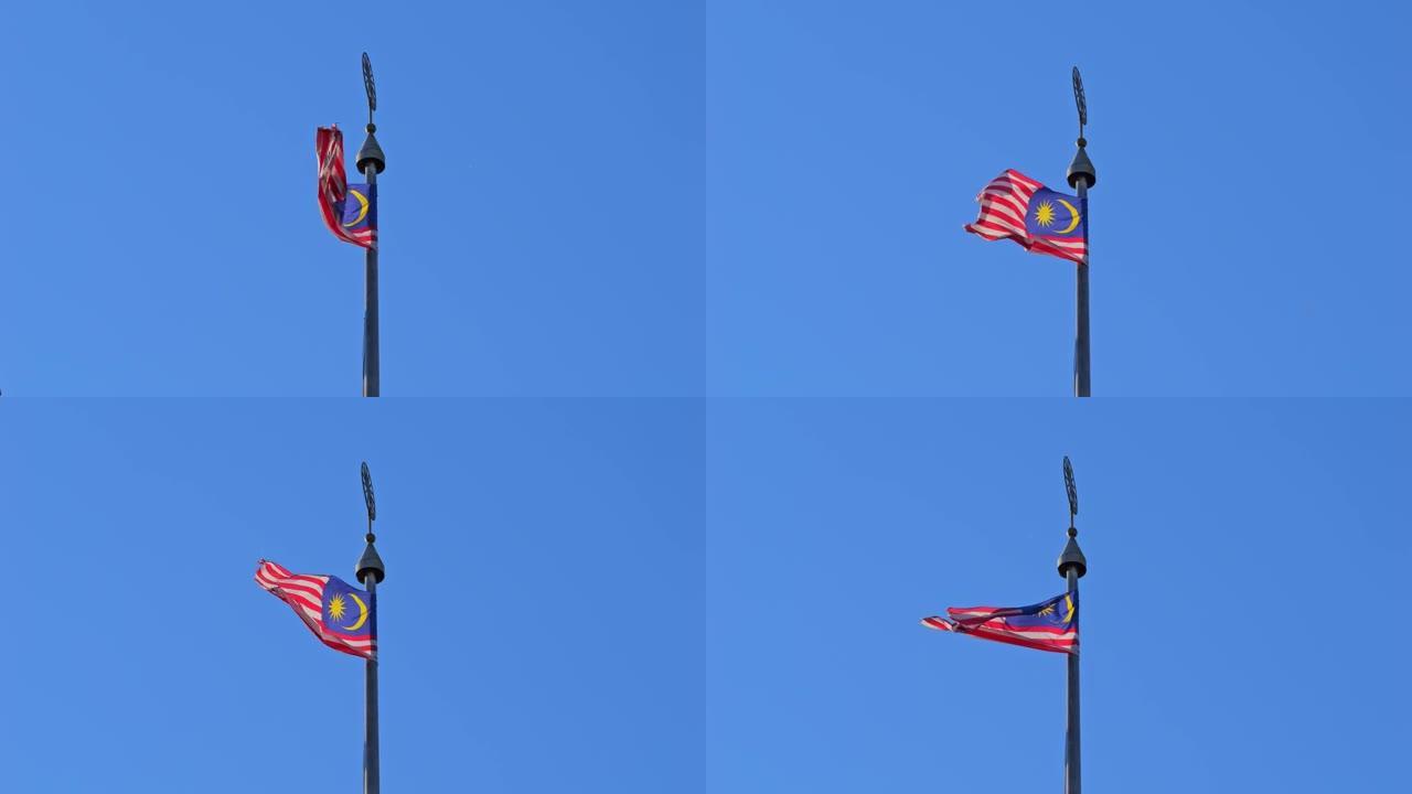 马来西亚的大国旗在风中飘扬，在阳光下飘扬。荣耀条纹。Jalur Gemilang。锋利的风。慢动作。