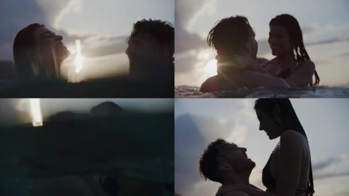 浪漫的异性恋夫妇在金色日落时在海里游泳。玩耍和拥抱