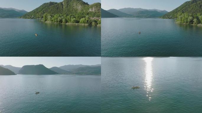 夏季晴天，高山湖被群山环绕