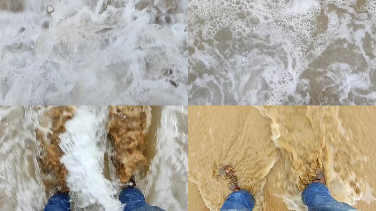 男性脚在海滩上被海浪弄湿