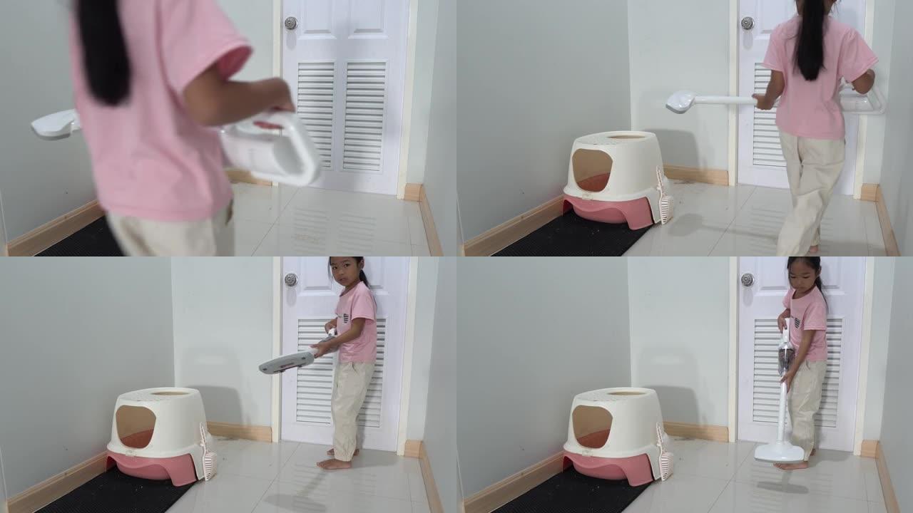 亚洲小女孩在家清洁猫砂托盘