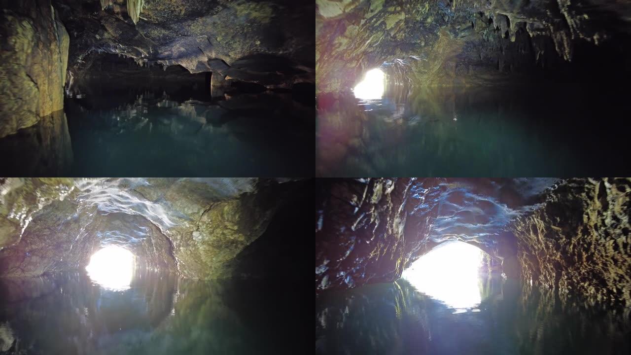 在黑暗的洞穴中的地下河上划船