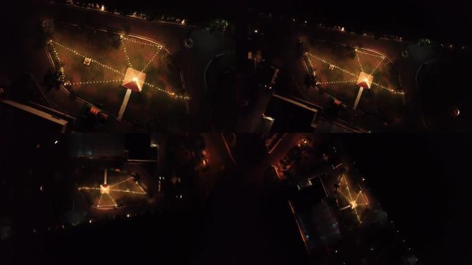 夜间带照明灯的公园的4k空中俯视图