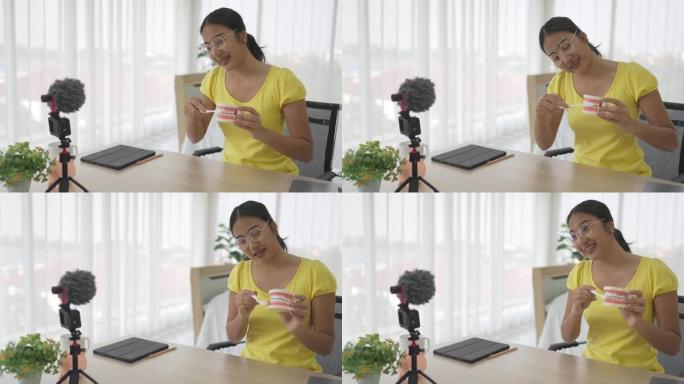 亚洲女教师折纸日本折纸风格，使用相机和笔记本电脑在线教学。