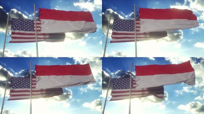 旗杆上插着印尼和美国国旗。印尼和美国的外交概念，蓝天背景