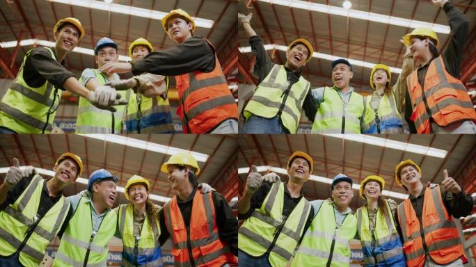 一群专业的亚洲工人庆祝，举手，行业工作成功。