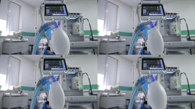 膨胀的ambu袋挂在手术室。模糊背景下肺部呼吸机的生命迹象屏幕。