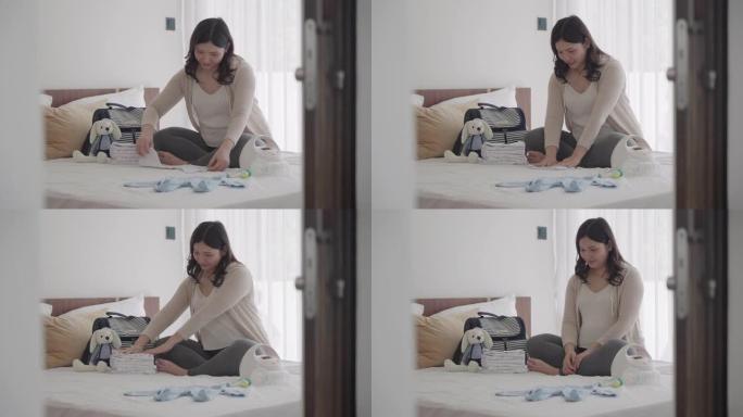 亚洲孕妇产前日历计划器和婴儿监视器用具，容器准备怀孕概念。
