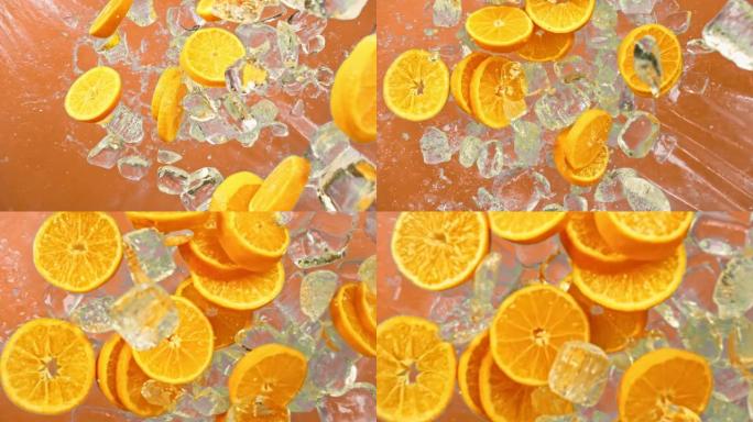 新鲜的橙色水果，冰块和滴多汁或酒精饮料或能量饮料或摇动苏打汽水飞溅倒入超级慢动作1000fps。冷橙