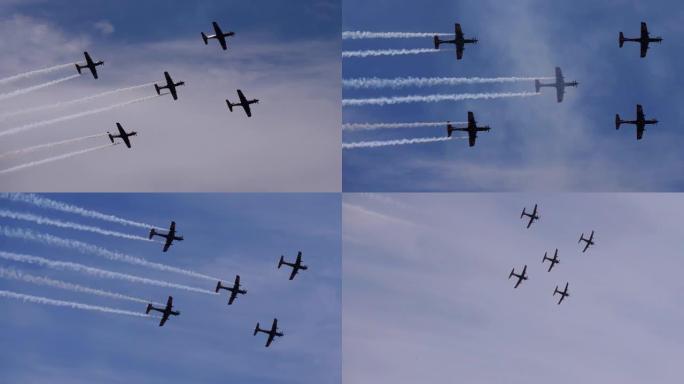 一群军机排放白色气体，在蓝天中以极快的速度飞行