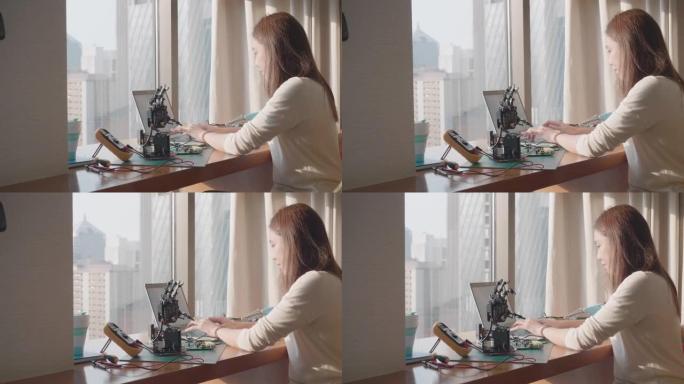 女性程序员编码软件应用于假肢机器人手臂控制机器人运动
