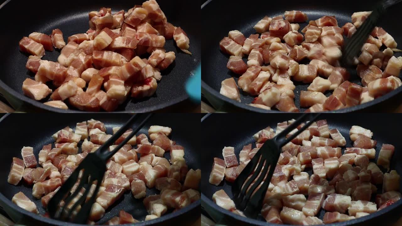 生猪肉块在平底锅里炒，特写，炒猪肉肉