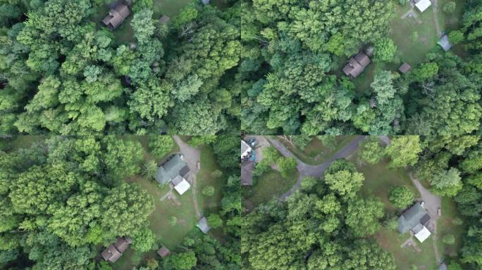 无人机捕捉了农村地区的航拍画面，那里的房屋被无数树木包围