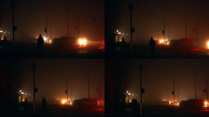 停电期间在昏暗的路灯中看到的人的深色轮廓。晚上停电时的城市。