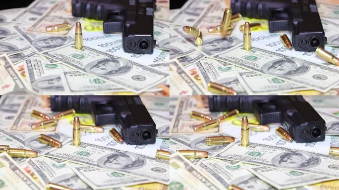 美元和欧元钞票背景上的枪和子弹，慢动作