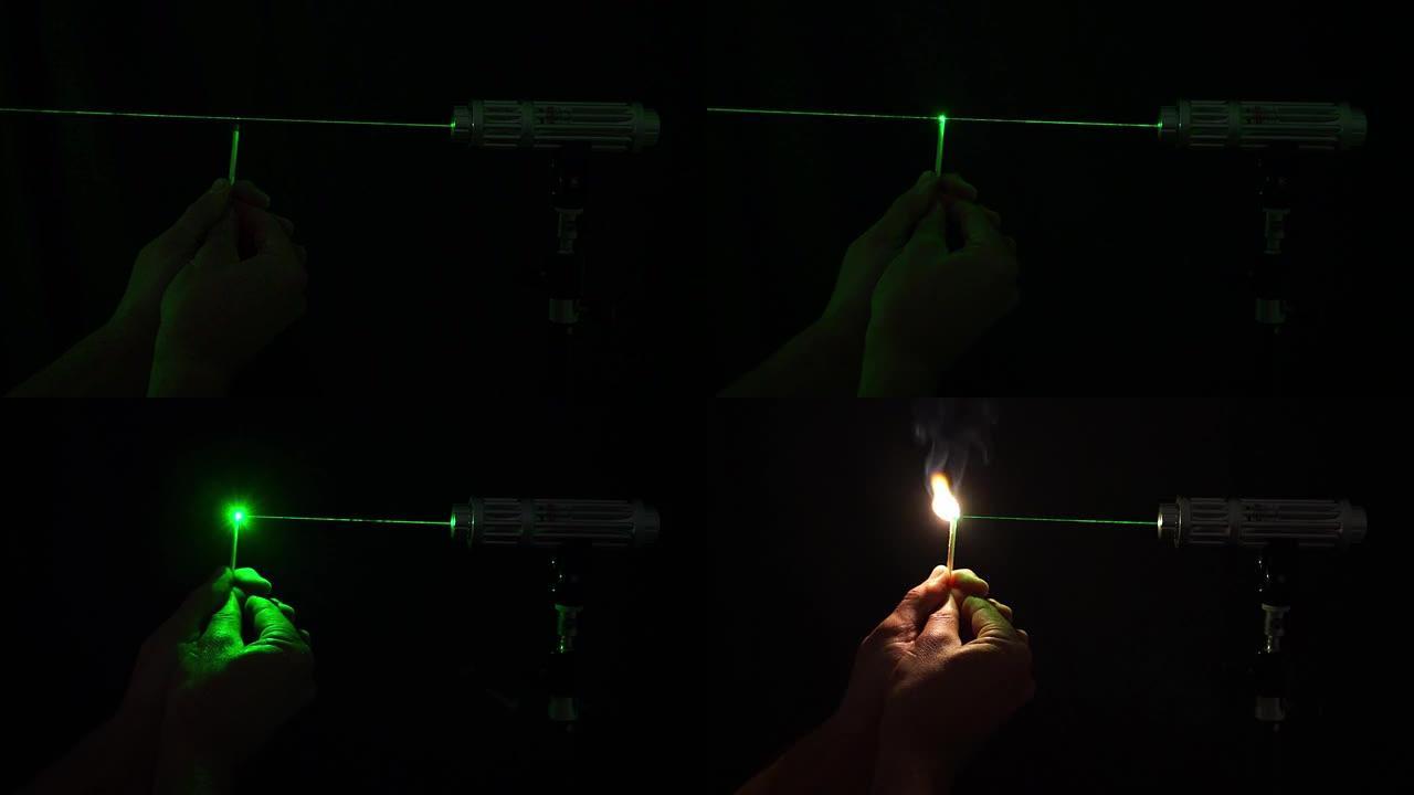 1mw瓦绿光激光束装置照明火柴杆的演示