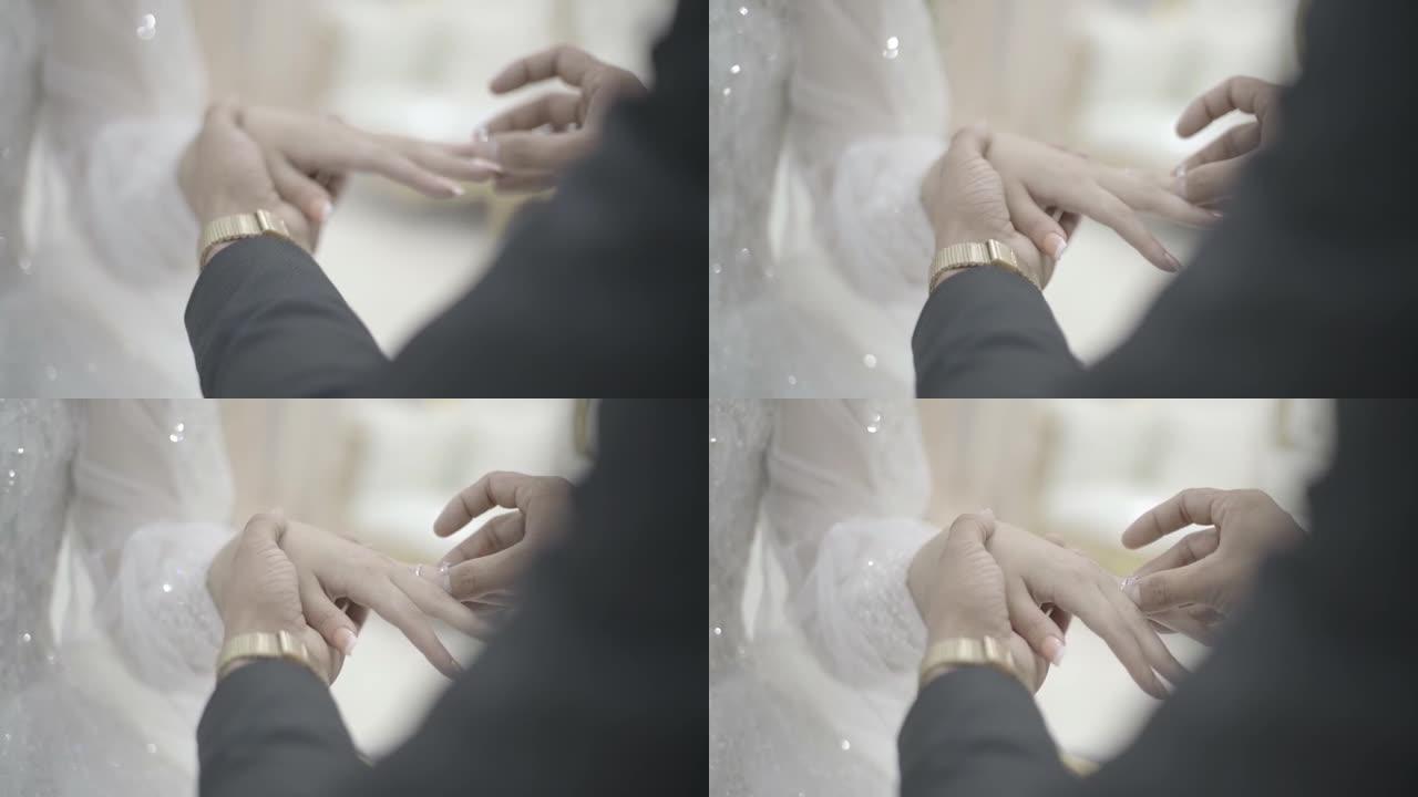 在婚礼上把戒指戴在手指上与她结婚