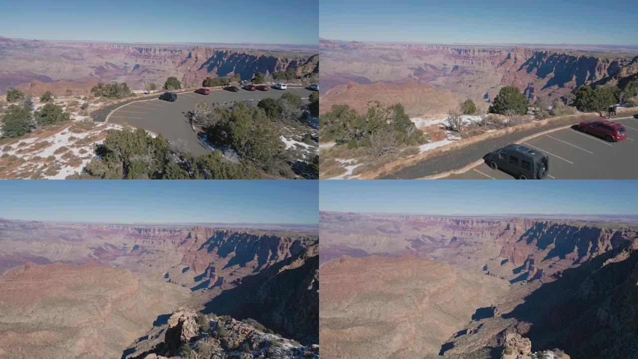 停放在俯瞰亚利桑那州大峡谷国家公园的道路上的车辆的无人机镜头