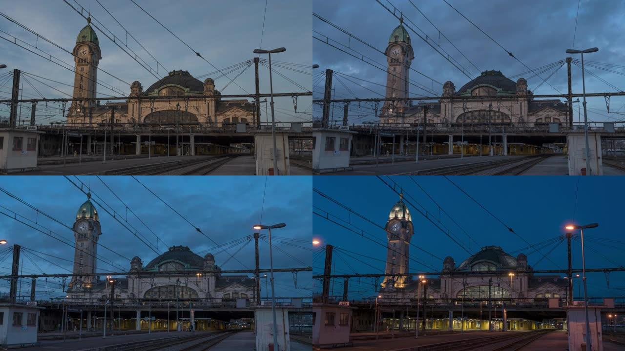法国利摩日市Benedictin火车站的白天到晚上的时间间隔和一些小云和夜光