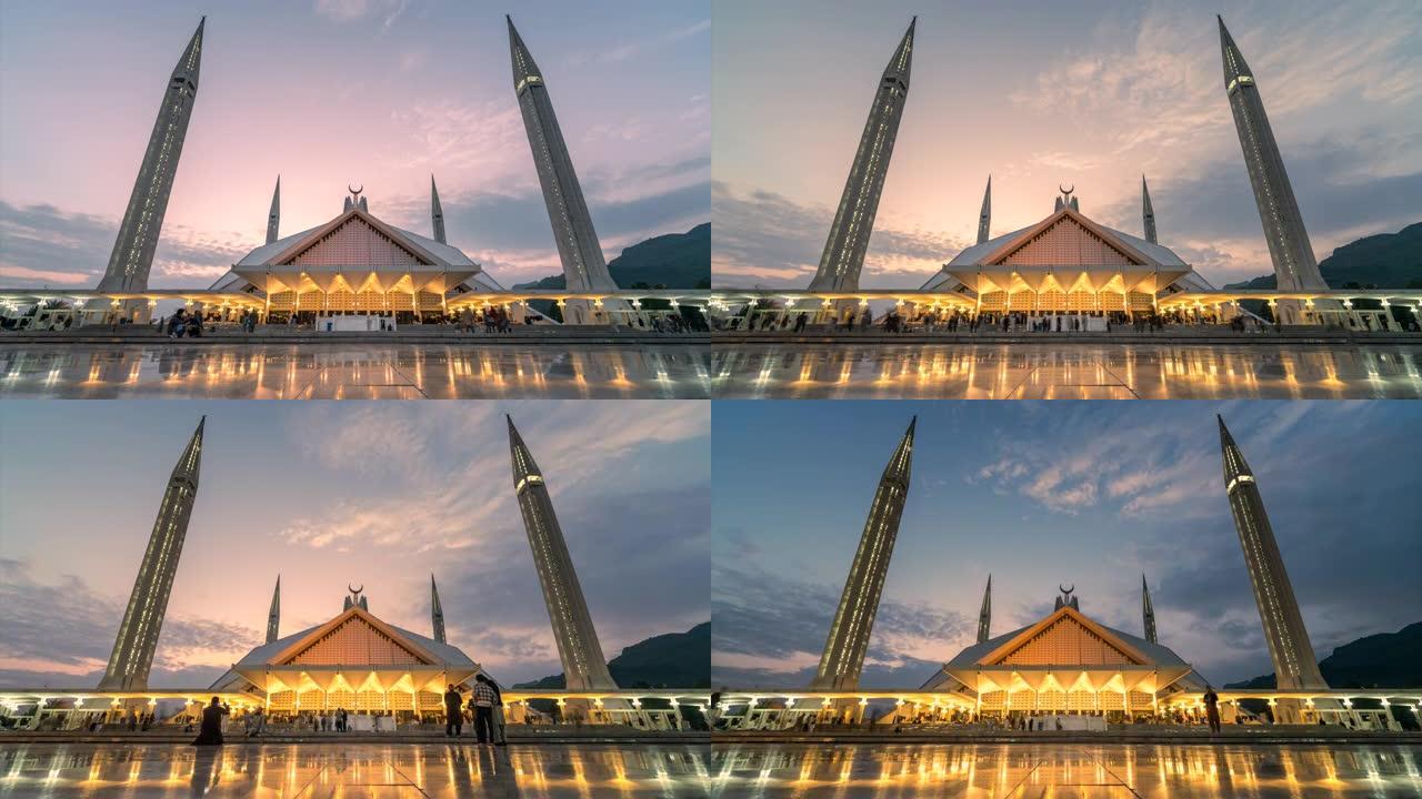 延时日落场景移动云和人在费萨尔清真寺著名的旅游地点在伊斯兰堡巴基斯坦