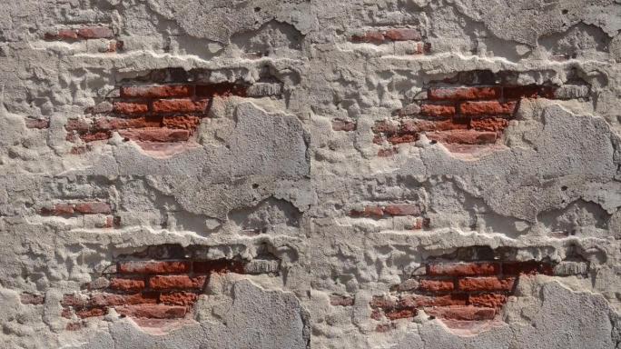 旧砖墙，水泥剥落，由地震或失修状态引起。