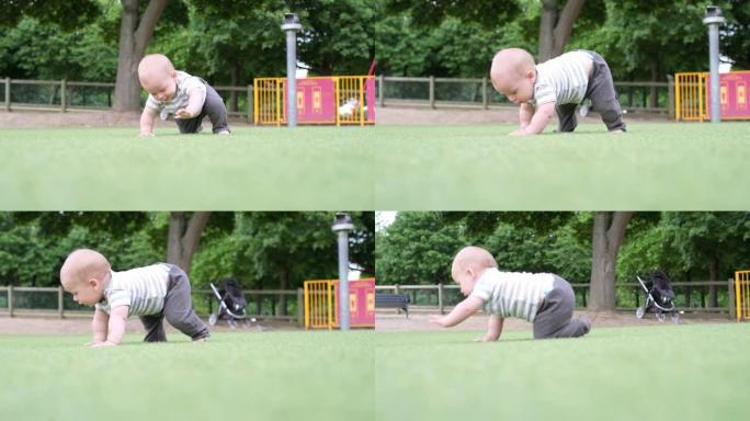 快乐的家庭野餐。小宝贝在绿草地上爬行。公园里的夏天。兄弟姐妹的孩子在绿色公园玩耍。游戏中的家庭乐趣和
