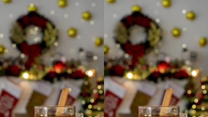 带有圣诞节背景和叮叮当的灯光的木制桌子上的圣诞节打孔。