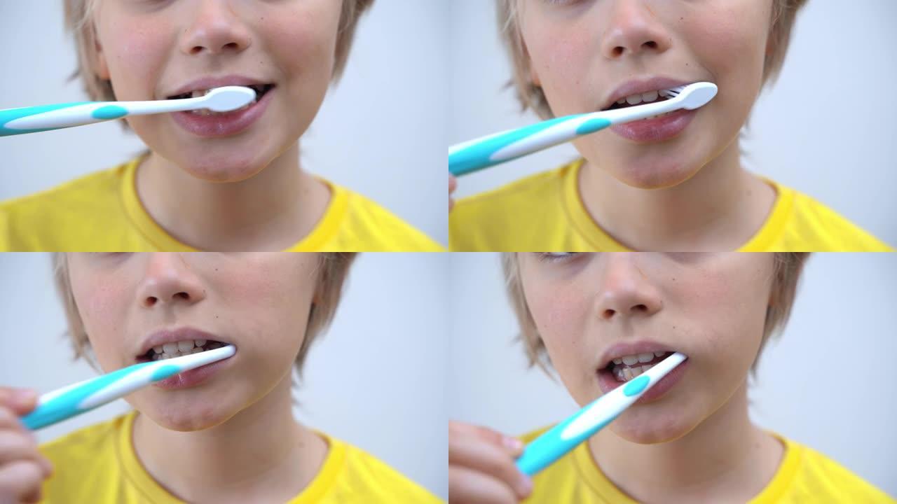 特写男生刷牙孩子看着相机，牙科，口腔科，牙科保健和卫生学用牙刷，早上晚上的例行公事，生活方式，保健。