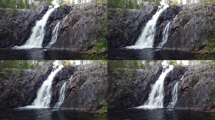 芬兰凯努地区令人叹为观止的hepopongas瀑布的特写和慢动作镜头。日落和秋季时，水从岩石中流出。