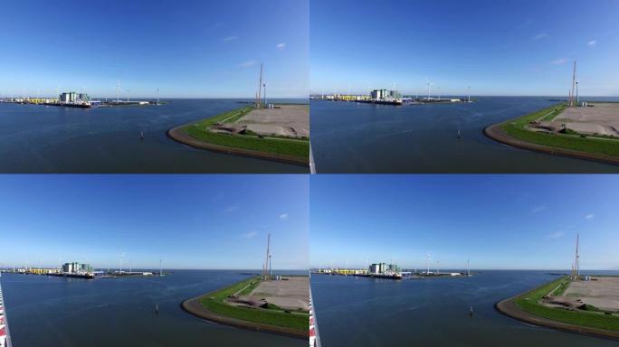 荷兰Eemshaven工业港口的发电厂和风神，从游轮上拍摄