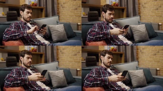 男子坐在沙发上使用智能手机，社交媒体用户，技术